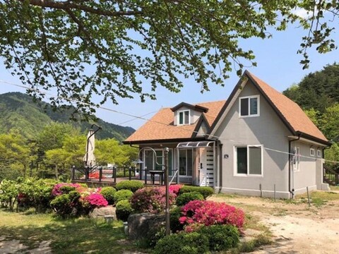 house with a waterfall