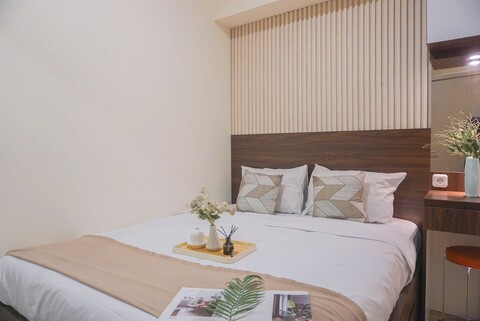 메이카르타 아파트의 따뜻하고 현대적인 스타일의 2베드룸