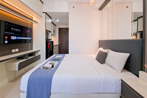 트랜스파크 빈타로 아파트먼트의 현대적인 모노크로매틱 스튜디오