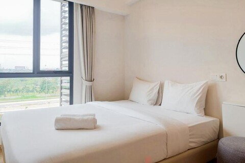 Nice and Elegant 2BR at Sky House BSD Apartment By Travelio
