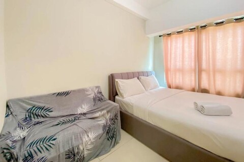 Pleasant and Tidy Studio Apartment Springlake Summarecon Bekasi Apartment By Travelio