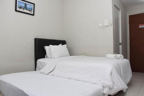 Homey and Tidy Studio Taman Melati Margonda Apartment near Campus By Travelio