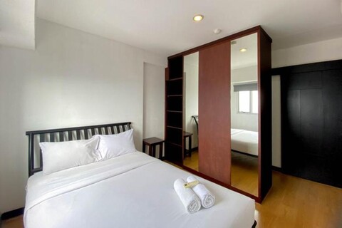 Elegant and and Spacious 1BR The Wave Kuningan Apartment By Travelio