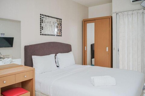 Furnished and Simple Living Studio Serpong Greenview Apartment By Travelio