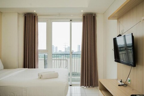 Minimalist and Warm Studio Casa De Parco Apartment By Travelio