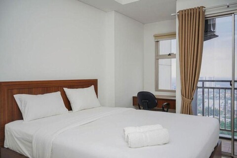 Cozy and Functional Studio Apartment at Springwood Residence By Travelio