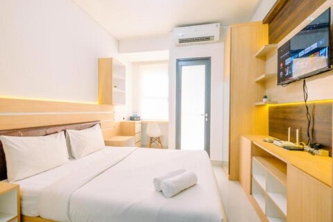 Homey and Well Design Studio Transpark Cibubur Apartment by Travelio