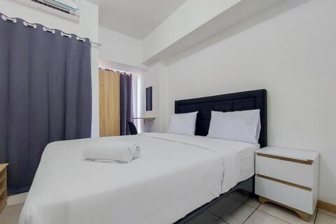 Homey and Elegant Studio Apartment M-Town Residence By Travelio