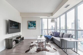 Luxury 1BR Suite w Skyline City Views - The Roland