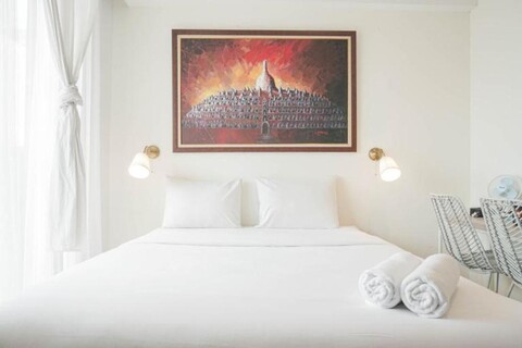 Minimalist Studio Room with City View at West Vista Apartment By Travelio