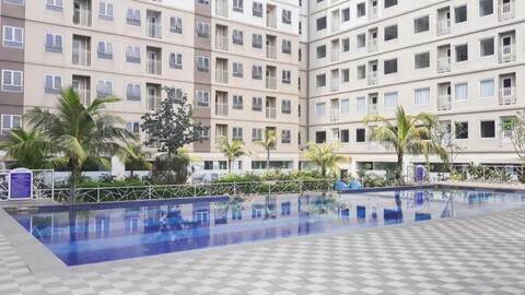 Minimalist & Comfy 2BR @ Titanium Square Apartment By Travelio