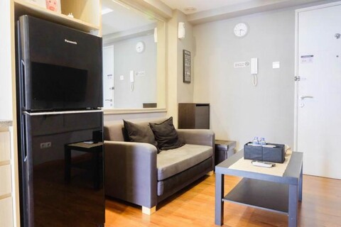 Exclusive and Spacious 1BR Apartment at Bassura City By Travelio