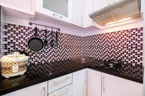 Homey 1BR with Spacious Living Room and Sofa Bed Green Pramuka Apartment