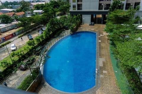 Modern and Tidy 1BR Serpong Greenview Apartment By Travelio